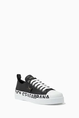 Buy Dolce Gabbana Black Portofino Sneakers with Branded Plate Logo Print in Leather For Women Online Ounass Bahrain