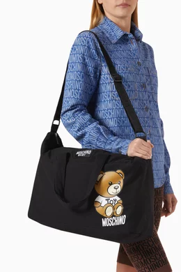 Black moschino changing bag 2025