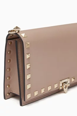 Buy Valentino Garavani Neutral Valentino Garavani Rockstud Crossbody Clutch in Leather For Women Online Ounass Bahrain
