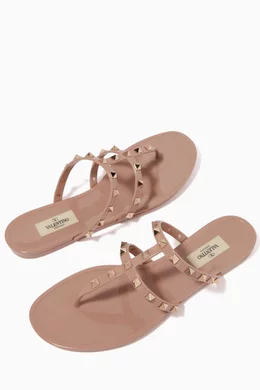 Buy Valentino Garavani Neutral Rockstud Flat Sandals in Rubber For Women Online Ounass Bahrain
