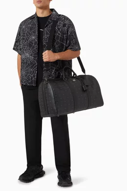 Buy MCM Black Ottomar Weekender 55 Bag in Coated Canvas For Men Online Ounass Bahrain