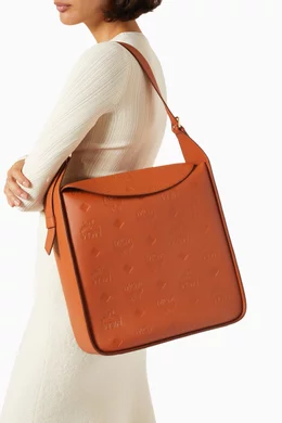 Buy MCM Brown Large Aren Flap Hobo Bag in Monogram embossed Leather For Women Online Ounass Bahrain