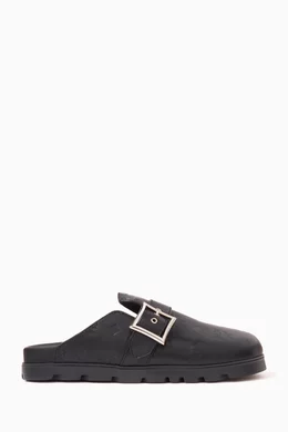 Buy MCM Black Flat Mules in Monogram Leather For Men Online Ounass Bahrain