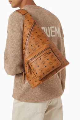 Mcm sling backpack discount