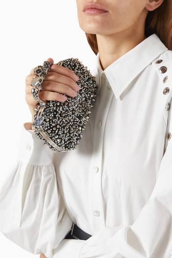 hover state of Skull Embellished Four-ring Clutch in Leather