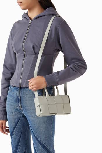 hover state of Mini East-West Arco Tote Bag in Intreccio Leather