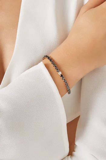 سوار تنس مرصع بماس أسود ذهب وردي عيار 18