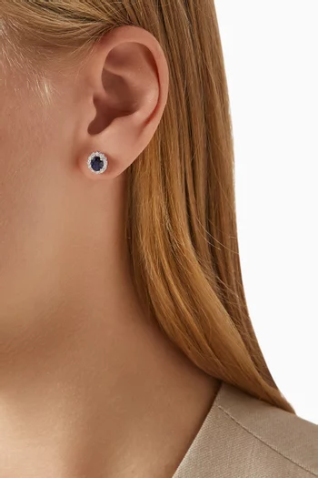 أقراط مرصعة بياقوت بيضاوي وماس ذهب أبيض عيار 18