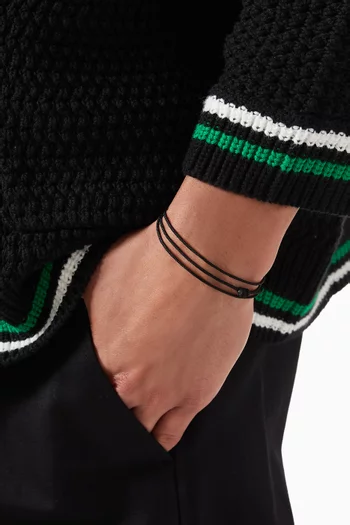 سوار بتصميم رباط بشعار زهرة الزنبق