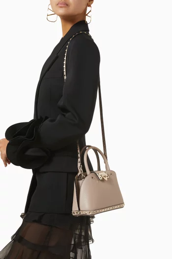 Small Rockstud Top-handle Bag in Grained Calfskin