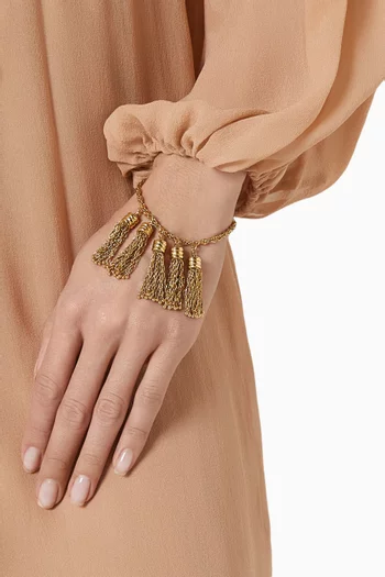 سوار مزين بكرات بوم بوم نحاس بلون ذهبي