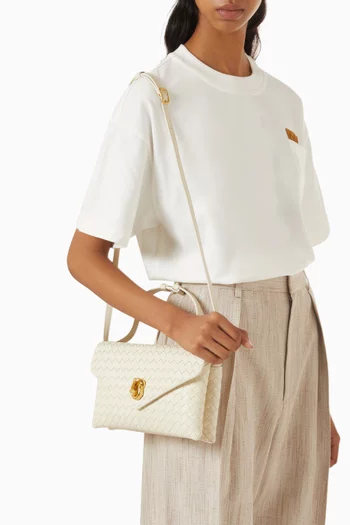 حقيبة كروس بقفل على شكل عقدة جلد مجدول