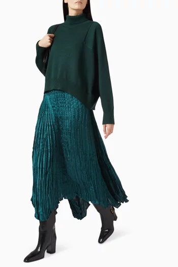 تنورة متوسطة الطول بقصة غير متماثلة بطيّات بليسيه