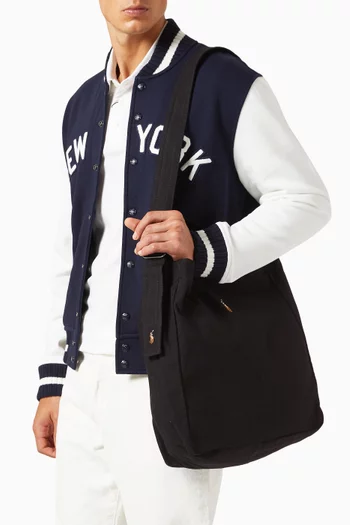 حقيبة يد كبيرة بشعار لاعب البولو المميز للماركة قنب