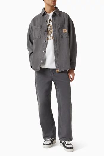 تي شيرت بتصميم جامعي وشعار الماركة بنقشة جلد الفهد قطن