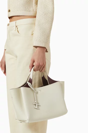 حقيبة ميني بحلية على شكل حرف T جلد