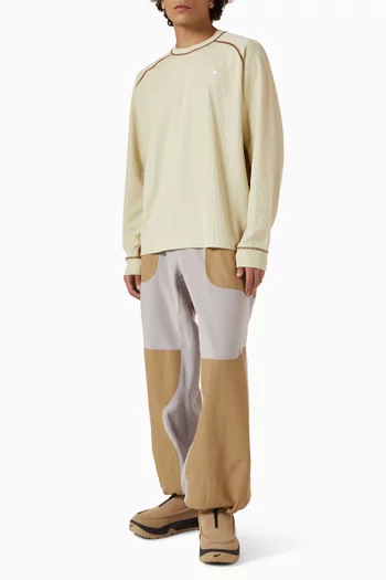 تي شيرت بأكمام طويلة وتقنية Dri-FIT ADV من مجموعة ايه سي جي