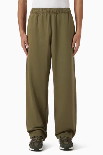 بنطال بشعار سولو وحافة مفتوحة صوف