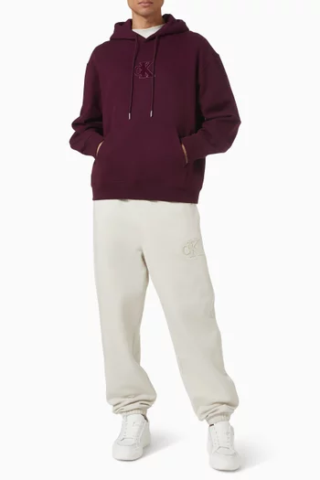 كنزة بغطاء رأس بقصة فضفاضة ورقعة شعار الماركة صوف