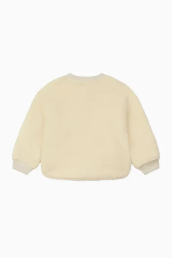 سويت شيرت مطرز بشعار زهرة بوكي صوف تيدي