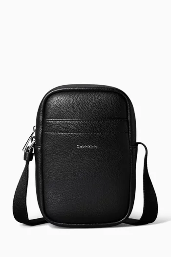 Raised Slim Reporter Crossbody Bag in Faux Leather