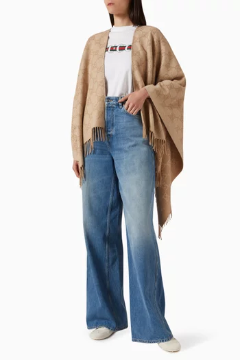 بونشو بحواف بشرّابات كشمير لامع بشعار حرفي GG