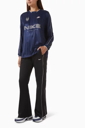 بنطال رياضي واقٍ من الرياح بقصة ضيقة