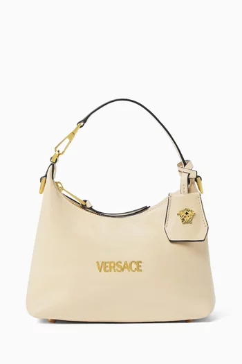 حقيبة هوبو بشارة جلد نابا