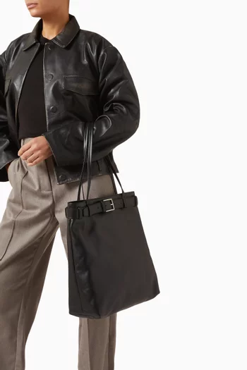 حقيبة يد مزينة بحزام جلد