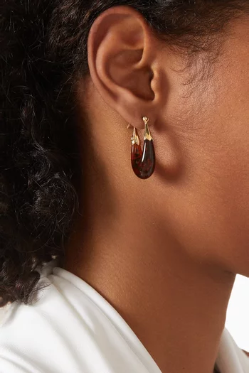 أقراط إكوم أسيتات