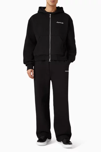 بنطال رياضي بقصة ساق واسعة وشعار الماركة مزيج قطن