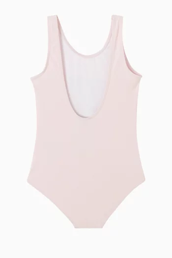 لباس سباحة بطبعة زهرة وشعار الماركة