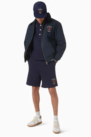 شورت قصير مزين بوردة وشعار الماركة قطن