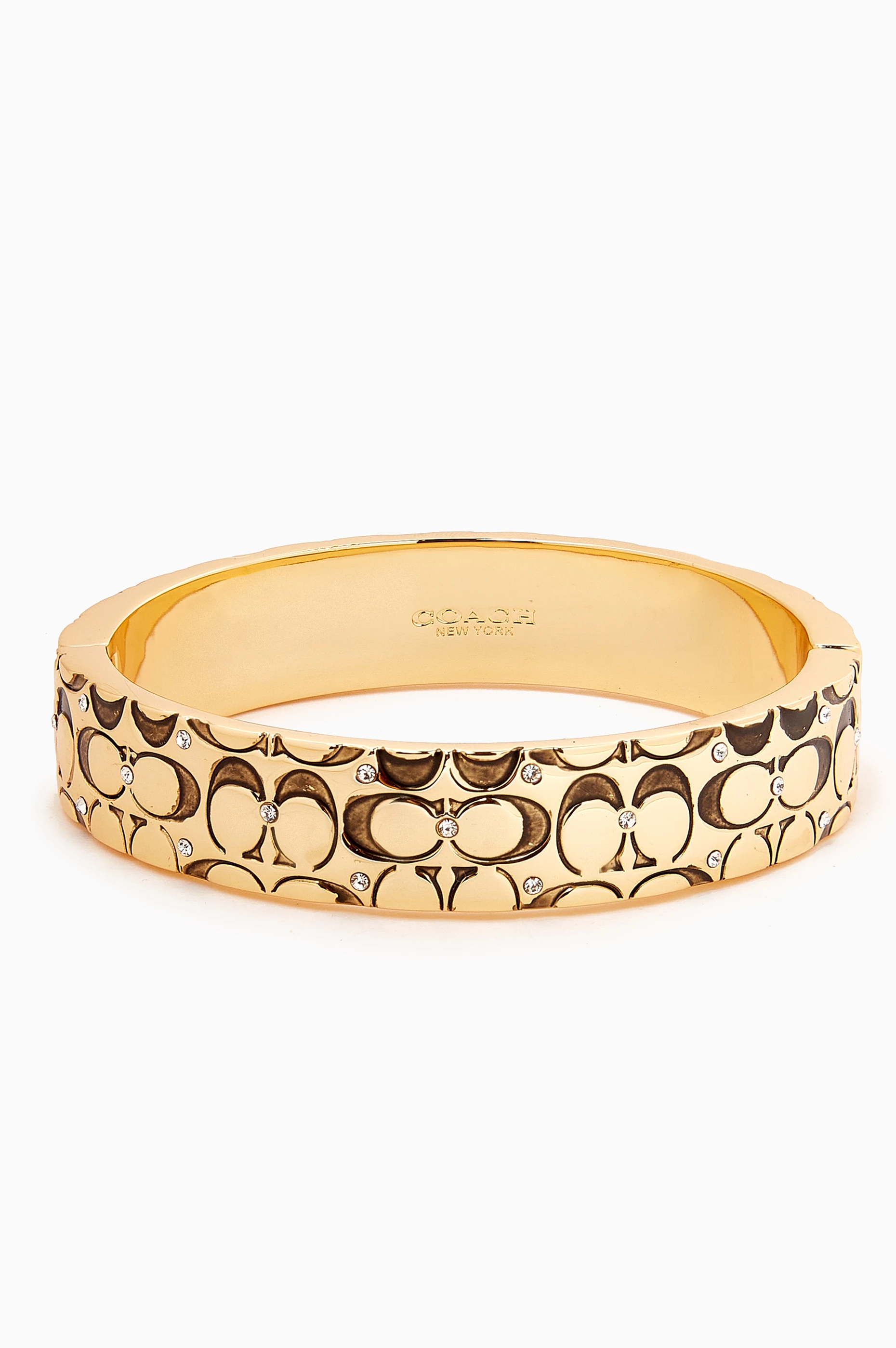 Shop Coach Gold Quilted C Hinged Bangle in Metal for WOMEN | Ounass Bahrain